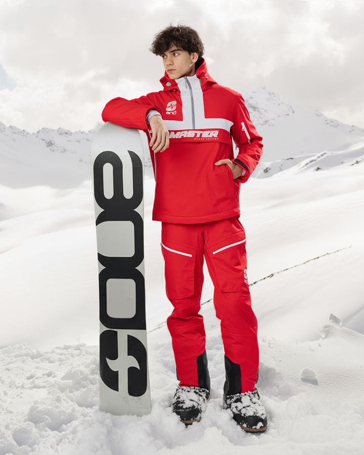Jan — red ski jacket and trousers with snowboard
