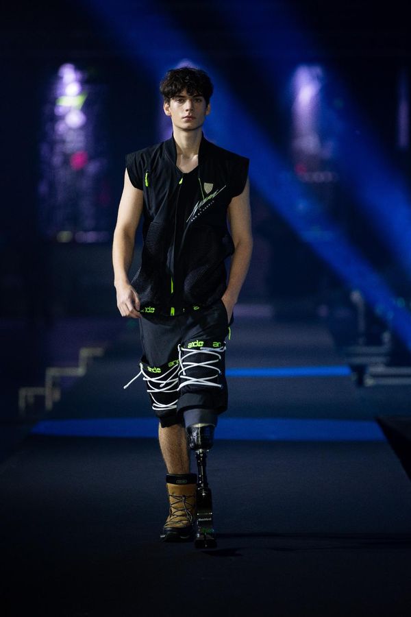 Jan — runway, black vest and laced shorts